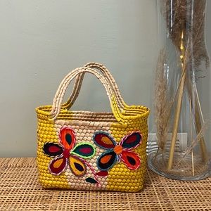 Wicker basket bag with fun 3D floral print on front